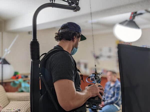 Documentary film crew recording interview for Move-In Multnomah housing program