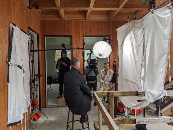 Film crew capturing interview on location for Move-In Multnomah video production