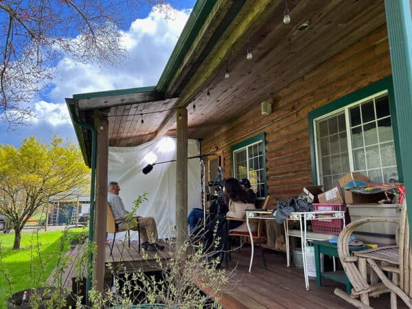 Outdoor documentary interview filming setup on a porch for a public health campaign in Oregon