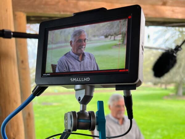 Camera monitor showing an interview subject during filming of a public health campaign video in Oregon